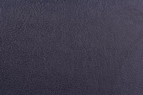Dark blue leather surface as a background, leather texture. Skin Stock Photos