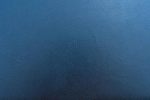 Dark blue leather texture background with fine grain detail and subtle shading Stock Photos