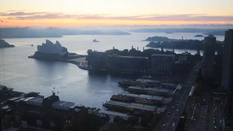 Dark blue misty sunrise over Sydney city landmarks from elevation of The Rocks. Stock Footage 135307643