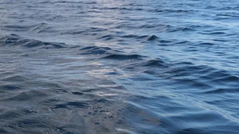 Dark blue mixing water surface of a lake, sea, ocean with waves, ripples Stock Footage 243708456