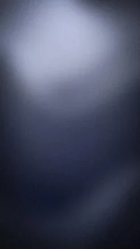 Dark blue navy gradient background with grainy textured blur for vertical w.. Stock Photos