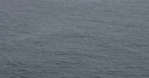 Dark Blue Ocean Water Surface with Gentle Ripples and Texture Stock Footage 328228643