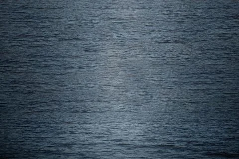 The dark blue ocean waves background. Stock Photos