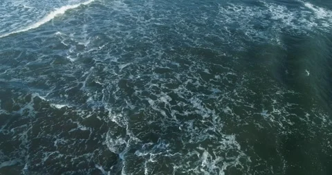 Dark blue ocean waves rolling softly The Concept of natural tranquility Stock Footage 336096816