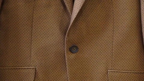 Dark blue patterned bow tie on brown suit jacket background. Happy Fathers day Stock Footage 98254959