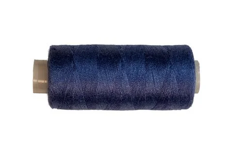 Dark blue polyester sewing thread spool with textile winding texture Foto stock