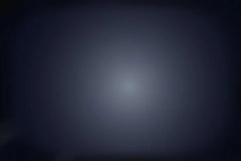 Dark blue radial gradient backdrop with central soft illumination for artis.. Stock Photos