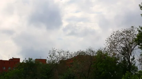 Dark blue rainy clouds over apartment house in summer evening Stock Footage 50965998