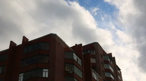 Dark blue rainy clouds over apartment house in summer evening Stock Footage 50988021