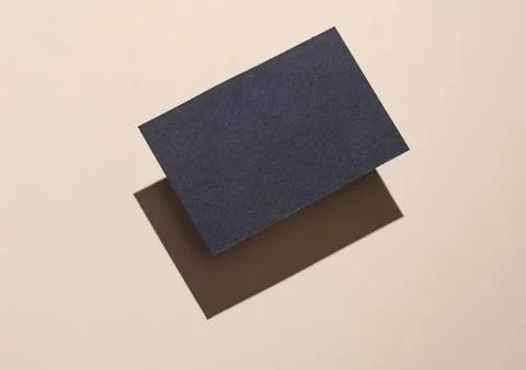 Dark blue rectangular eraser on beige background with shadow Stock Photos