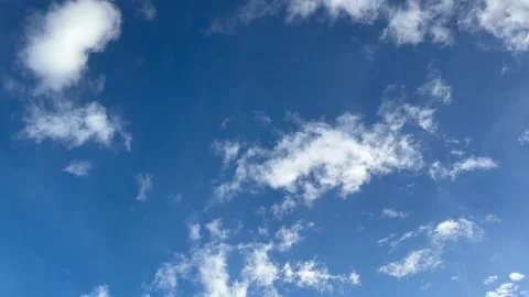 Dark blue sky with soft white clouds drifting peacefully Stock Footage 314098338