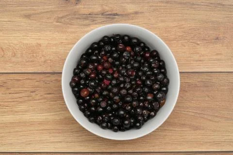 Dark blue small grapes or Vaccinium meridionale, agraz, close up. Stock Photos