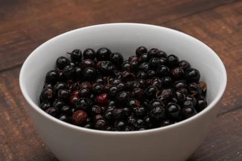 Dark blue small grapes or Vaccinium meridionale, agraz, close up. Stock Photos