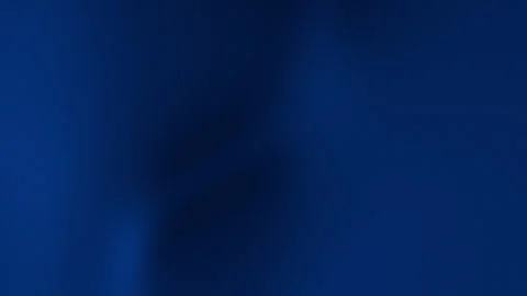 Dark blue solid background with a subtle glitter texture. Video stock 306378831