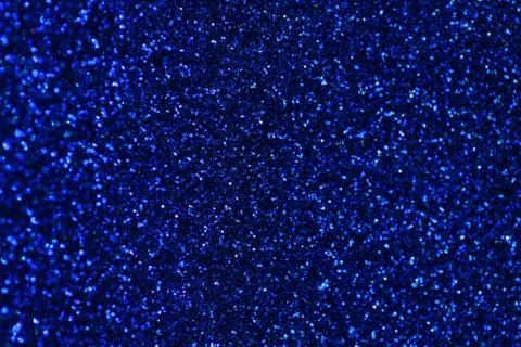 Dark blue sparkling background from small sequins, closeup. Brilliant backdro Stock Photos