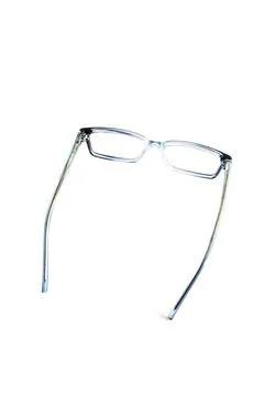 Dark blue square eyeglass frames in the photo from the side isolated on a whi Stock Photos
