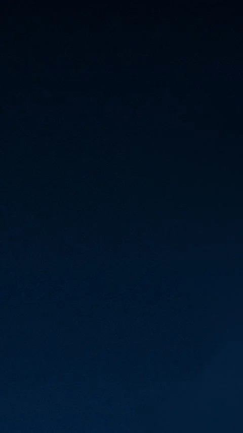 Dark blue textured gradient with grain effect. Seamless loop background. 4K. Vídeo Stock 309701662