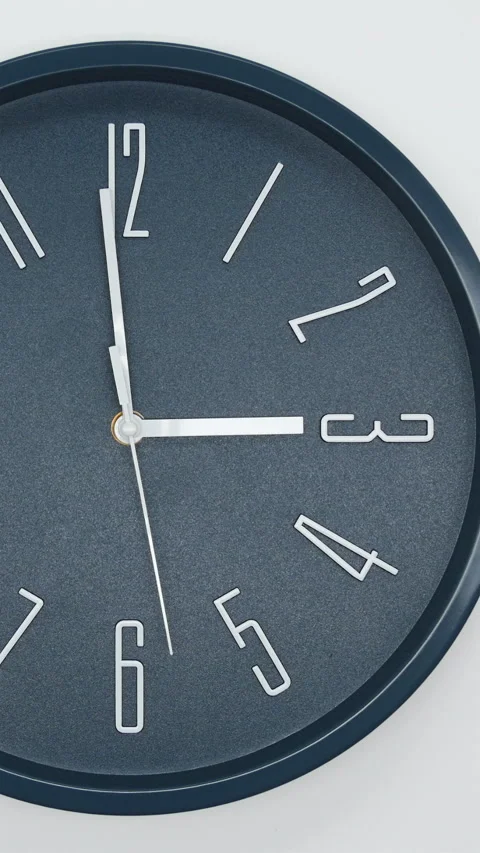 Dark Blue Wall Clock With A White Arrows And White Second Hand Of Time Of 3.00 A Stock Footage 266730272