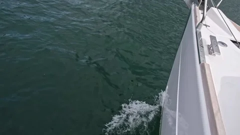 Dark blue water over the side of the yach in slow motion Stock Footage 197906542