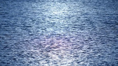 Dark blue water surface with ripples and sun path Stock Footage 76273335