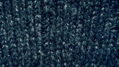 Dark blue wool knit texture macro closeup revealing fuzzy fibers in cozy midn Foto stock