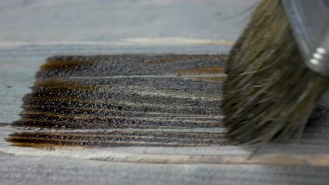 Dark board staining with clear varnish. Macro paint brush Stock Footage 143420355