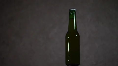 Dark bottle on a dark background 4K Stock Footage 147057910