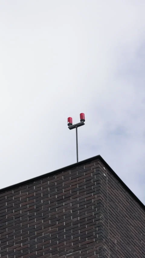 Dark brick building corner with red warning lights Stock Footage 342934840