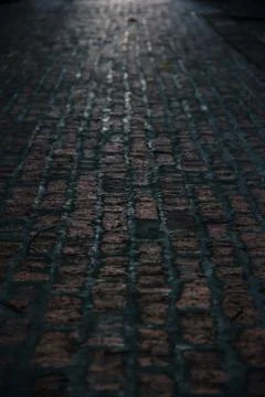 Dark brick road surface background texture Stock Photos