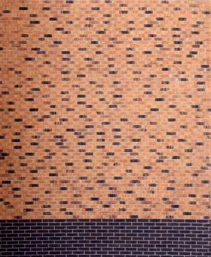 Dark brick wall pattern with chaotic masonry order. Background texture or r.. Stock Photos