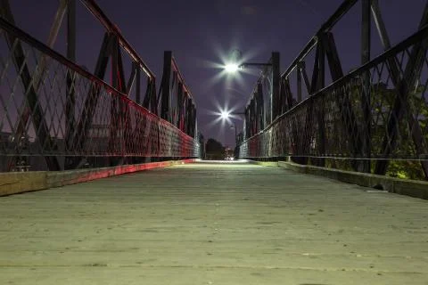 Dark bridge over the train tracks Stock Photos