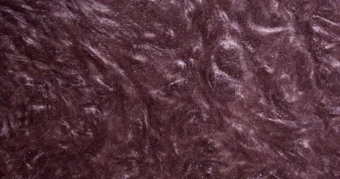 The dark, bright paint with glitters bubbles heavily, shimmering Video stock 158524709