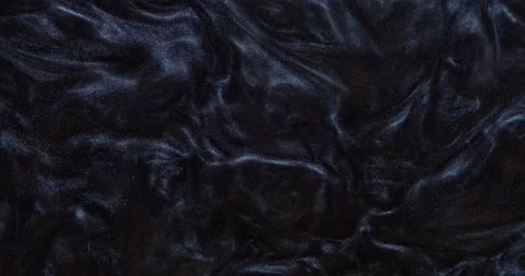 The dark, bright paint with glitters bubbles heavily, shimmering Stock Footage 158524960
