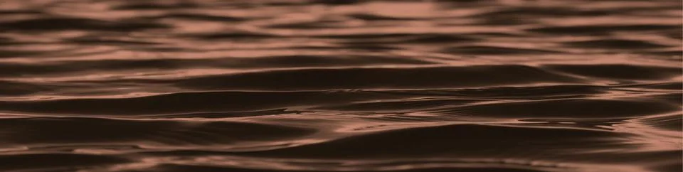 Dark brown abstract background. Reflection of light on the smooth surface of Stock Photos
