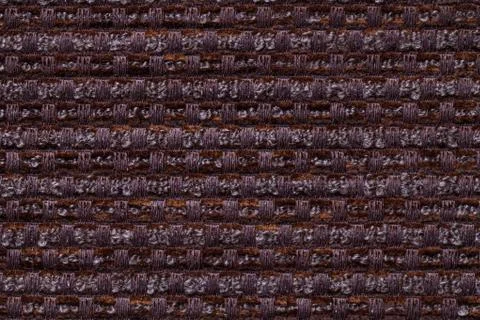 Dark brown background from checkered pattern textile, closeup. Structure of t Stock Photos