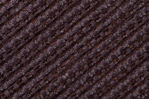 Dark brown background from checkered pattern textile, closeup. Structure of t Stock Photos