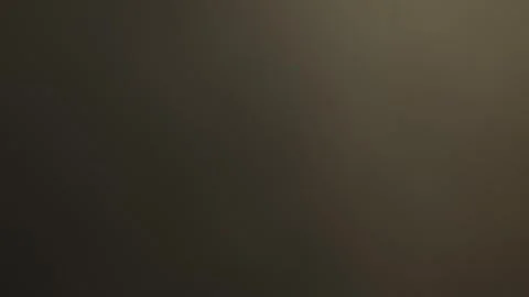 Dark brown background with moving light. Animation of an abstract background. Stock Footage 310315895