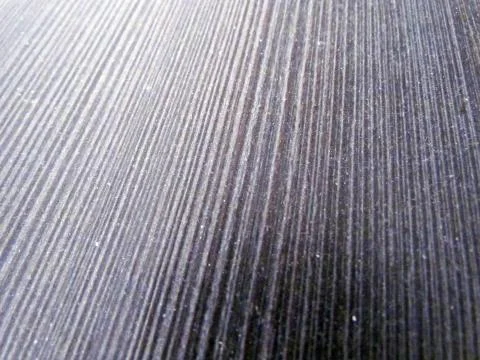 Dark brown background with perforation Stock Photos