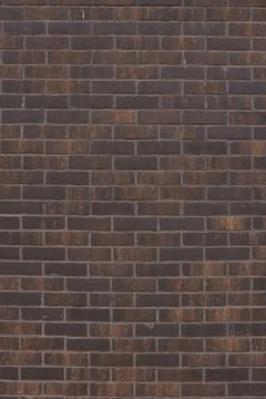 Dark brown brick wall texture background showing masonry pattern Stock Photos