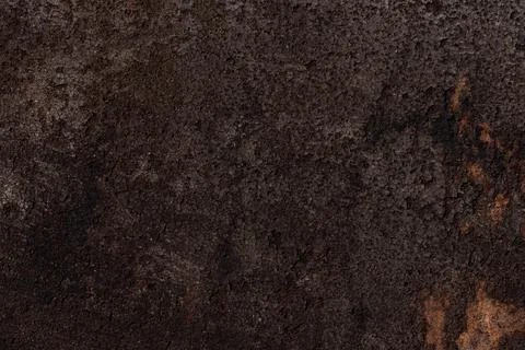 Dark brown bumpy rough surface, iron background with rust Stockfoto's