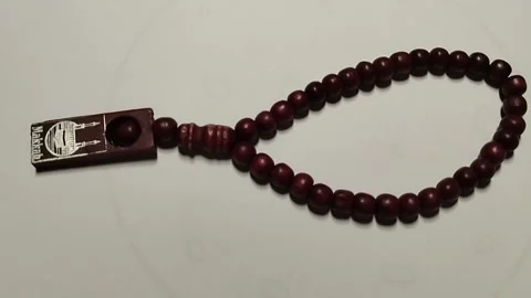 The dark brown circle tasbih is very attractive Stock Footage 224788268