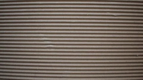 Dark brown corrugated cardboard with horizontal ridges Stock Footage 153348114