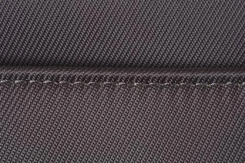Dark Brown Diagonal Ribbed Textile with Stitched Seam Stock Photos