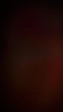 Dark brown grainy texture background with subtle black and red shades verti.. Stock Photos
