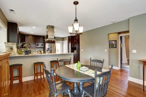 Dark brown kitchen room with dining area Stock Photos