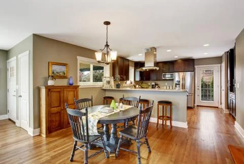 Dark brown kitchen room with dining area Stock Photos