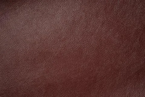 Dark brown leather texture can be use as background Stock Photos
