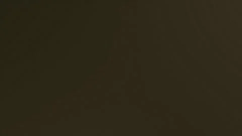 Dark brown plain background seamless loop motion. Stock Footage 336329038