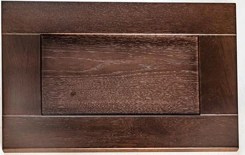 Dark brown rectangular kitchen facade close-up. wood textured decorative elem 写真素材