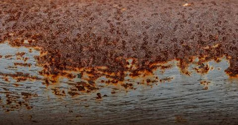 Dark brown rust on metal background 스톡 사진